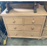 A pine chest of drawers with two short, two long drawers,