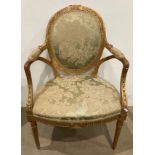 19th Century gilt wood open elbow armchair with oval panel back and padded arms and seat (saleroom