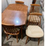 Mid-century teak circular leaf dining table and four matching teak spindle-back chairs by Dinette -
