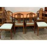 Parker Knoll teak compact oval extending dining table with pull-up leaf and six teak chairs