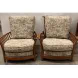 Pair of Ercol Renaissance high back easy chairs with light brown floral-patterned upholstery