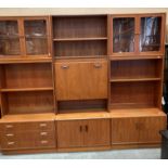 Mid-century teak G Plan three section wall unit system - one with three drawers to bottom,