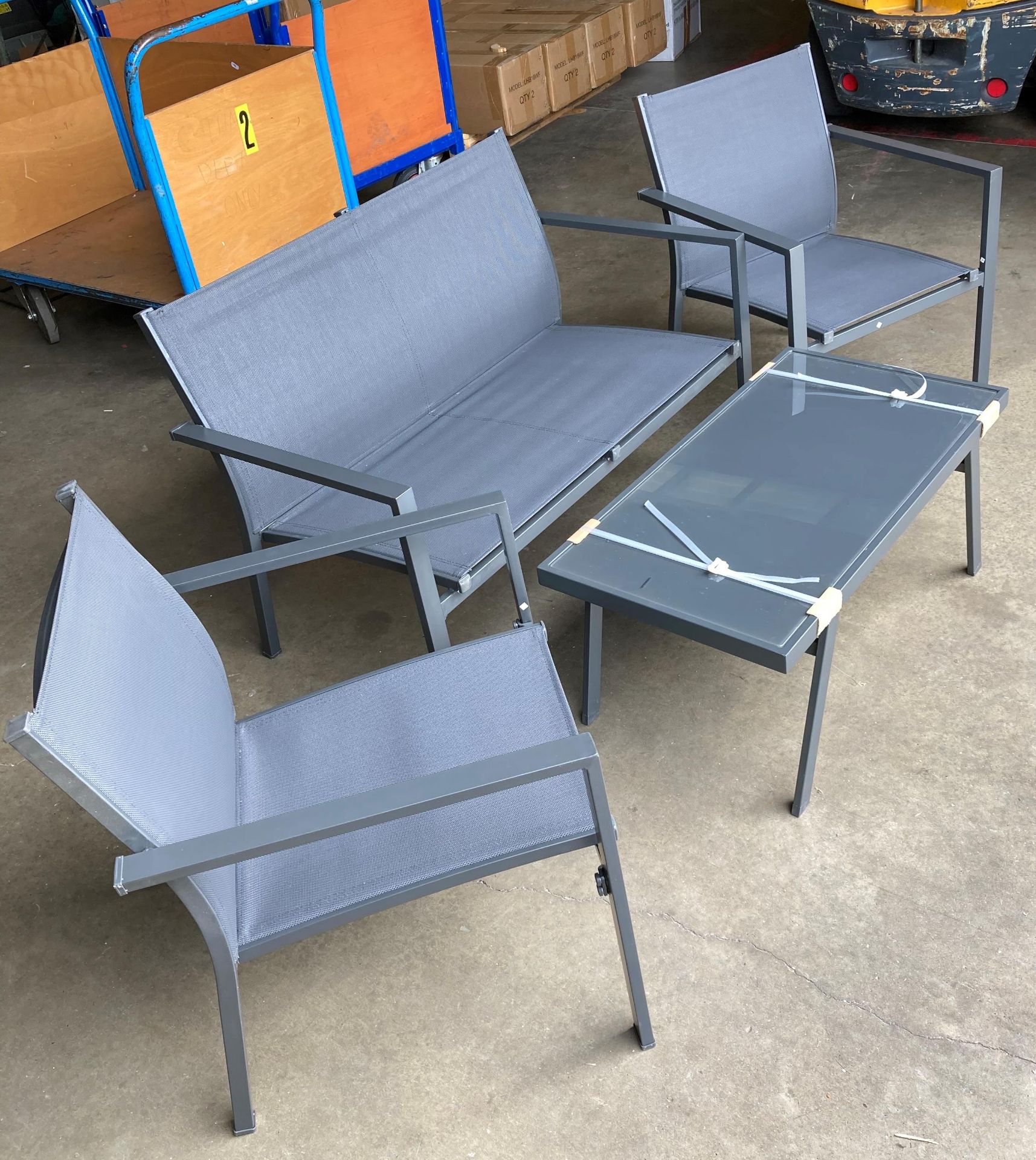 Brand new charcoal four-piece garden suite including two single armchairs,