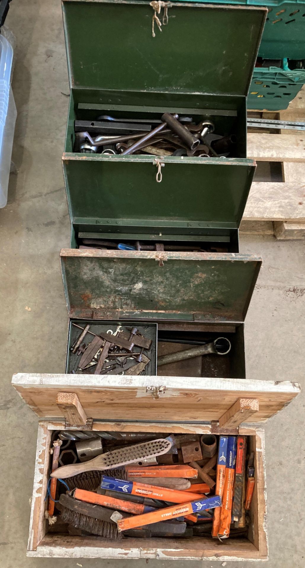 Three vintage green metal tool boxes,