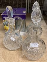 Three glass decanters with stoppers and a set of four tall beer glasses (4) (saleroom location: