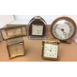 Contents to tray five clocks - Swiza oblong brass alarm clock 8cm high and travel alarm,