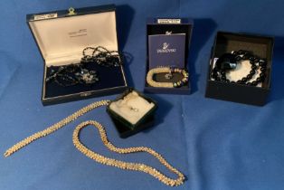 A selection of jewellery including a Swarovski carnival glass bracelet,