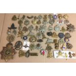 Box containing sixty plus metal badges - military, police,