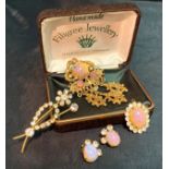 A collection of vintage/Kitsch jewellery including a rhinestone floral brooch,