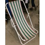 White metal framed deckchair with green,