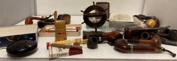 Contents to plastic tub - smoking memorabilia including a large selection of pipes,