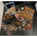A large quantity of mixed-period costume jewellery - brooches, clip-on earrings,