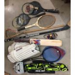 Box containing eleven sports items including cricket pads and bat, badminton rackets,