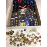 Two boxes containing badges and buttons of armed forces and civilian services including Royal and