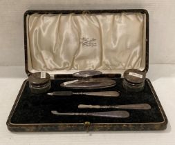 Cased six-piece silver handled [hallmarked] manicure set by W Greenwood & Sons, Birmingham 1922.