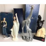Four composite figurines including three Shudehill with boxes - Lady in White Kiera 37cm high,