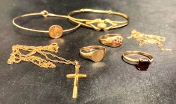 A selection of gold items - two 9ct gold bangles, one with St Christopher,