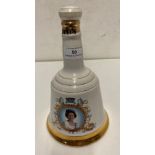 A Wade porcelain decorative decanter containing 75cl of Bell's Scotch whisky to commemorate Queen