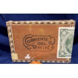 A sealed case of twenty-five Corriente del Rhil corona cigars and two brown leather four-cigar
