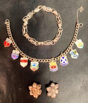 A selection of mixed-grade silver items - a souvenir charm bracelet,