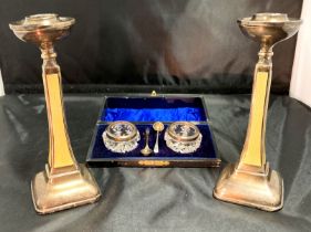 Two silver guilloche enamel candle sticks [hallmarked] and a boxed set of cut glass and silver