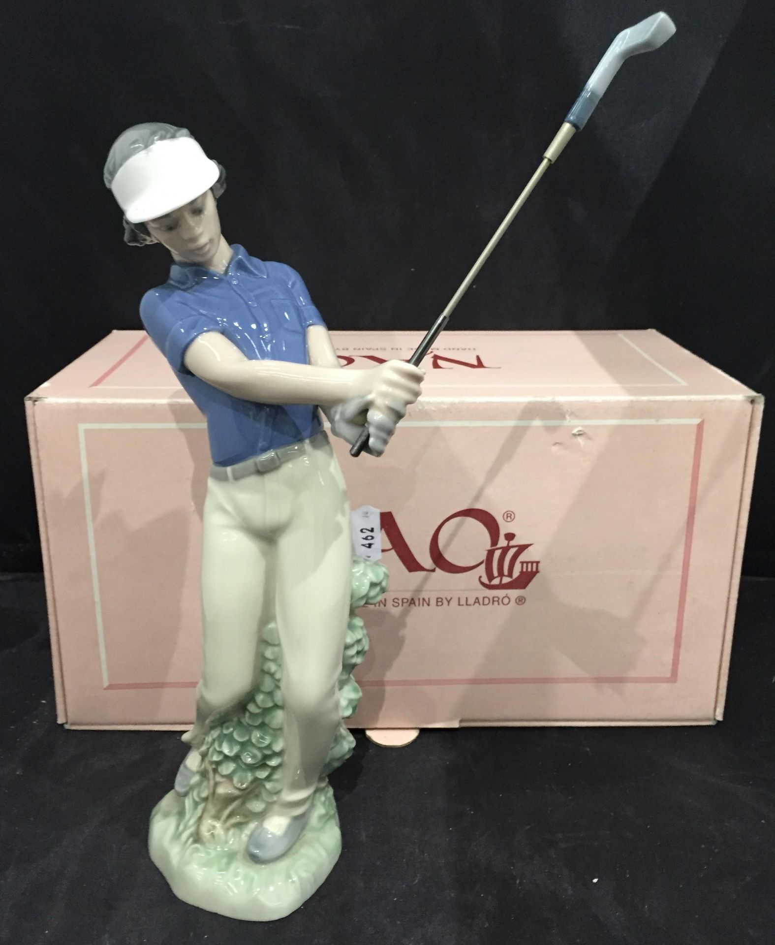 Nao figurine of male golfer,