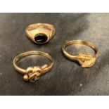 Three 9ct gold rings [stamped: 375] - one with leaf design (size O),