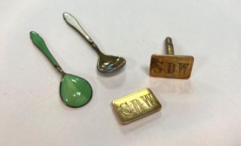 Two small silver [stamped] spoons with green and white enamelling and a pair of gold cufflinks