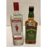 A 70cl bottle of Beefeater London dry gin (40% volume) and a 70cl bottle of Jack Daniels Tennessee