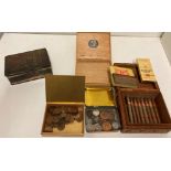 A small carved wooden box containing seventeen Willem II cigars sealed in cellophane,