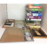 Twenty one items including ten jigsaw puzzles and eleven photo frames (saleroom location: T07)