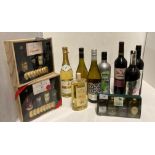 Mixed lot to include four bottles of red and white wine, a bottle of Babycham sparkling perry,