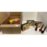 Three boxes pipes with plastic stands and three unboxed pipes with plastic stands,