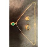 Four 9ct gold items including a heart-shape locket, a pedant with a green stone to centre,
