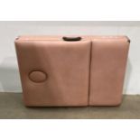Pink vinyl upholstered foldable beauty bed (saleroom location: S2 QB15)