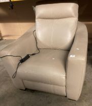 A beige leather electric recliner armchair (saleroom location: P0)