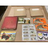 Contents to tray - two incomplete card albums/books - 'Our South African National Parks' with text