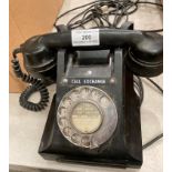 A black Bakelite telephone model 312L-GPO-FD.