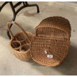 A wicker four bottle wine carrier and a wicker lidded basket (2) (saleroom location: S2 centre