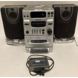 Bush Micro Audio System and a TomTom One (saleroom location: S2Q B06)