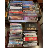 Contents to two trays - approximately eighty DVDs and DVD box sets including Clint Eastwood box set,