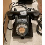 A black Bakelite telephone model 312F-558/3A (saleroom location: S3 T4)