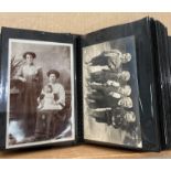 An album containing 100 postcards - mainly social history related (saleroom location: S3 T7)