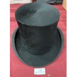 An R H Ramsdens Zephyr silk top hat (no size shown) in Chapman's Patent black box case (saleroom