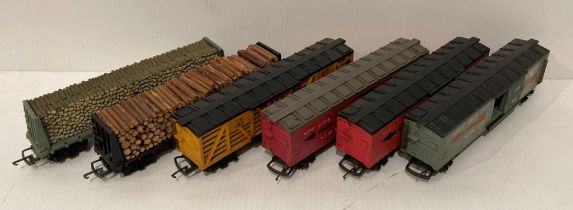 Four assorted Tri-ang HO/OO gauge sliding door cargo carriages including three TR2703 speedy