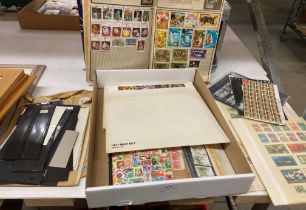 Contents to lid - small stamp albums, mint sets loose,