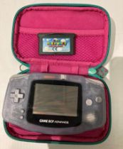 Nintendo Game Boy Advance model AGB-001 with Super Mario World,