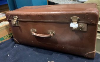 An Orient make brown fibre case 64 x 23 x 30cm containing a quantity of boomerangs (saleroom