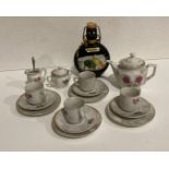 15-piece child's tea-set and a bottle of bull fighter wine (saleroom location: S1 T1)