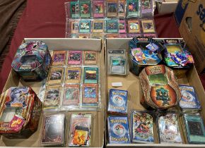 Contents to two trays - packs of Pokémon trading cards, Pokémon trading card games,